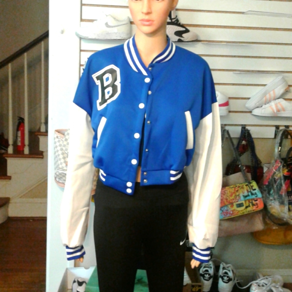 Women light weight varsity jacket. The mannequin is wearing a large size jacket